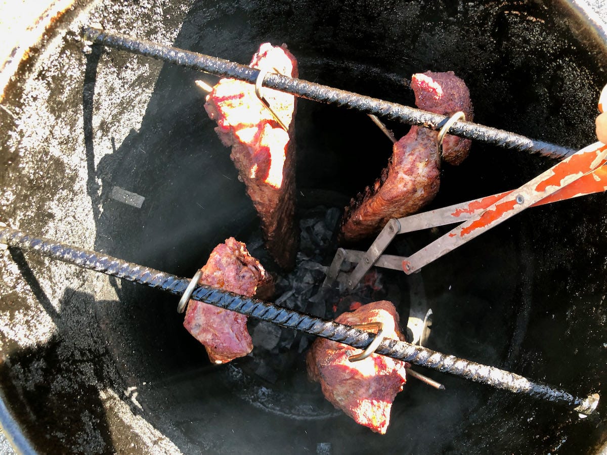 25” BBQ tongs allow you to reach down into the Pit Barrel Cooker to make any adjustments needed.