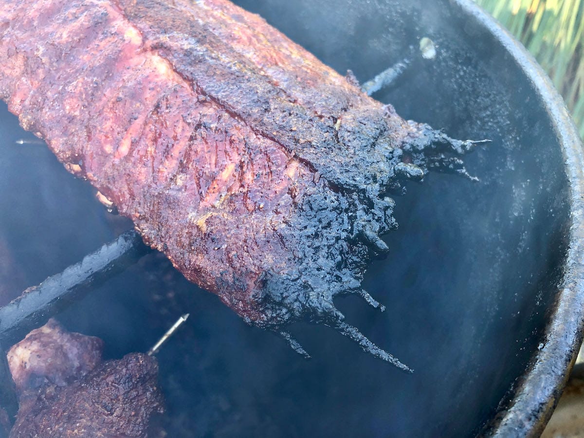 The fat and sauce drippings are hanging off the rack of ribs like BBQ icicles. Is it Christmas already? Oh boy! Where’s my Red Ryder BB Gun?