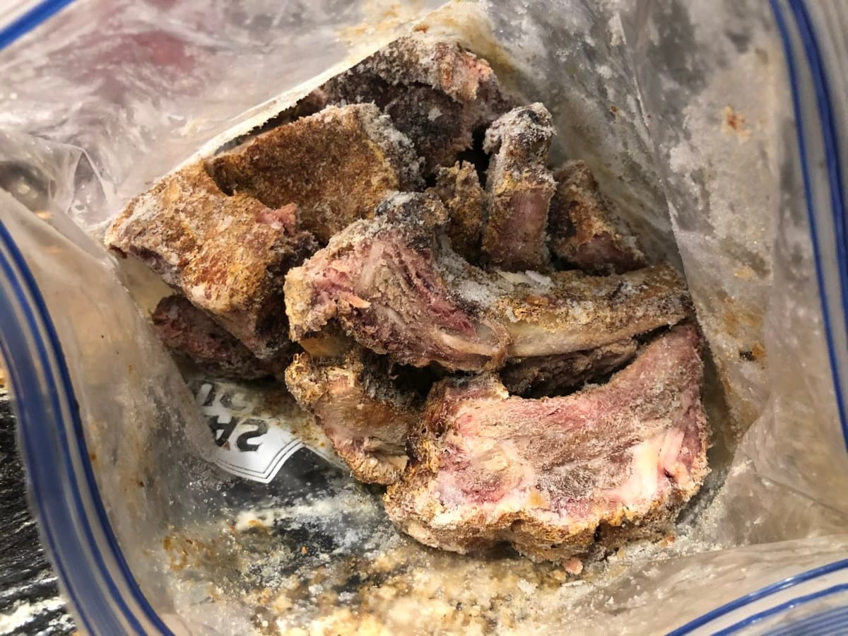 Frozen baby back ribs in ziploc bag.