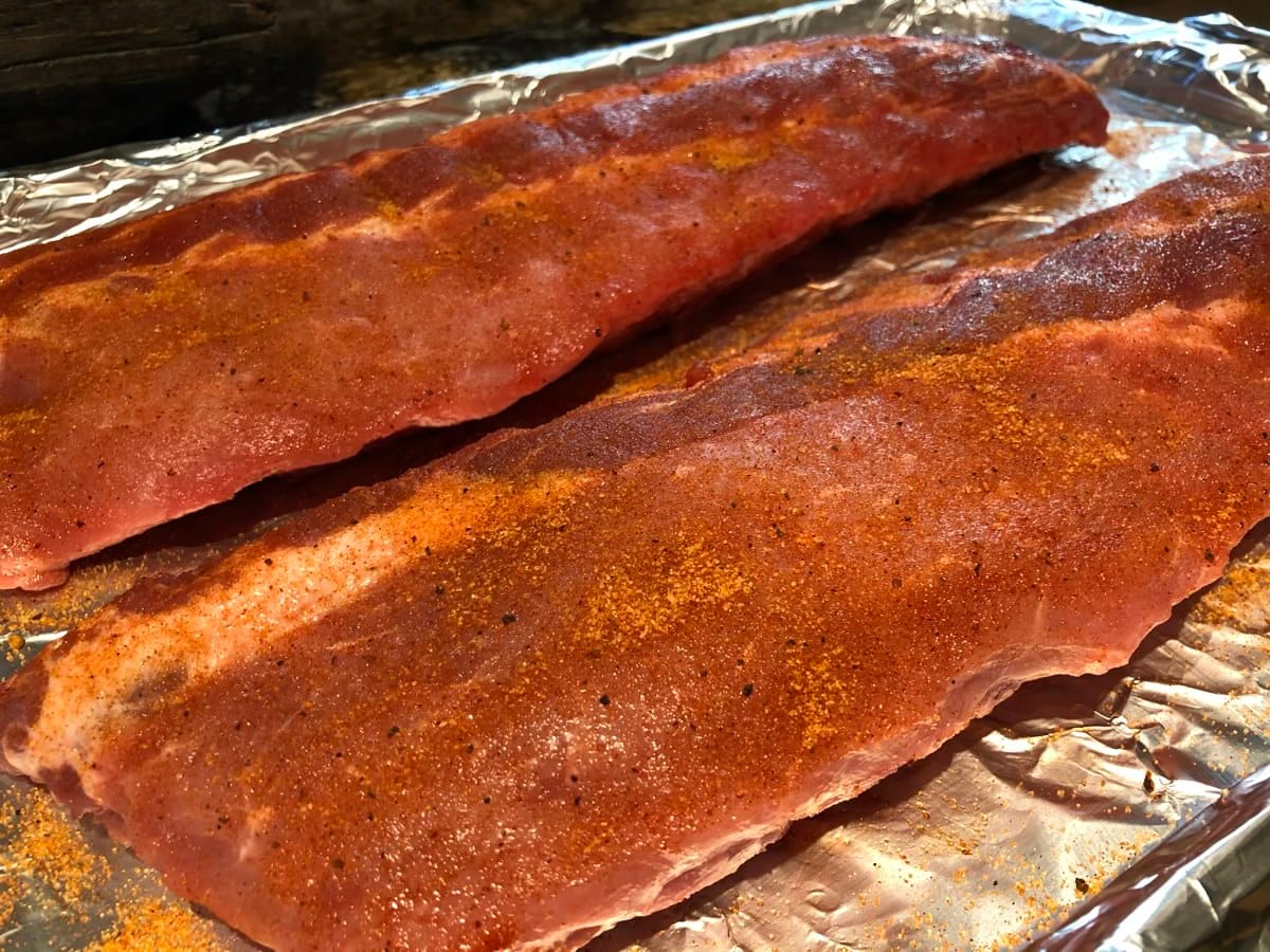 SuckleBusters Texas Pecan seasoning on baby back ribs.