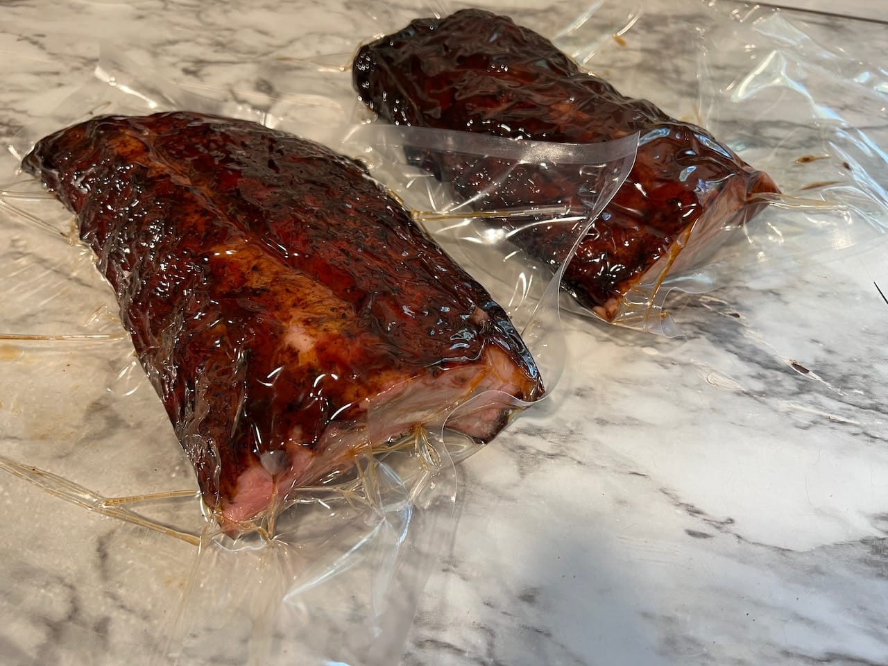 Half rack of baby back ribs vacuum sealed.