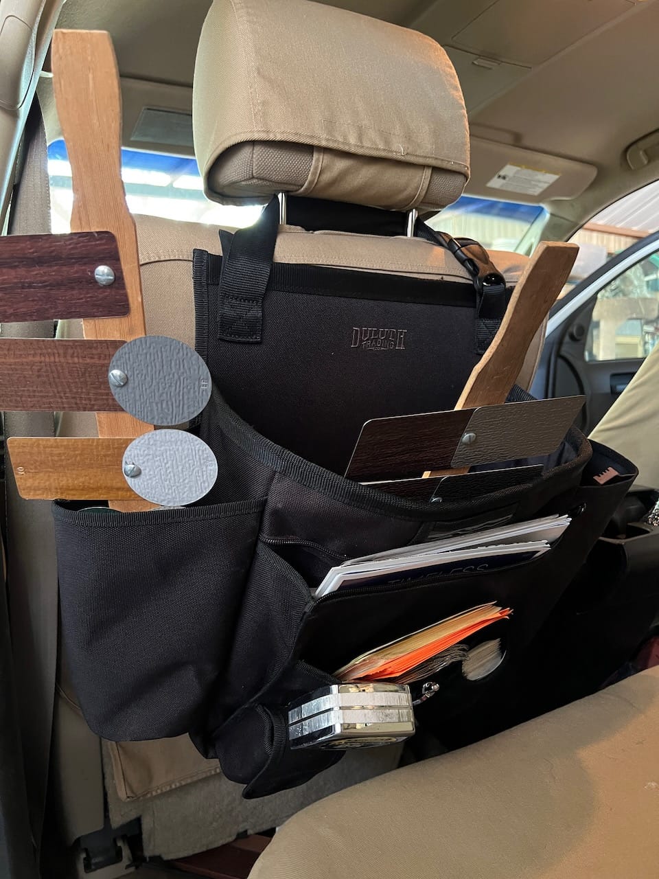 Duluth Cab Commander seat organizer mounted on the back of the drivers seat.