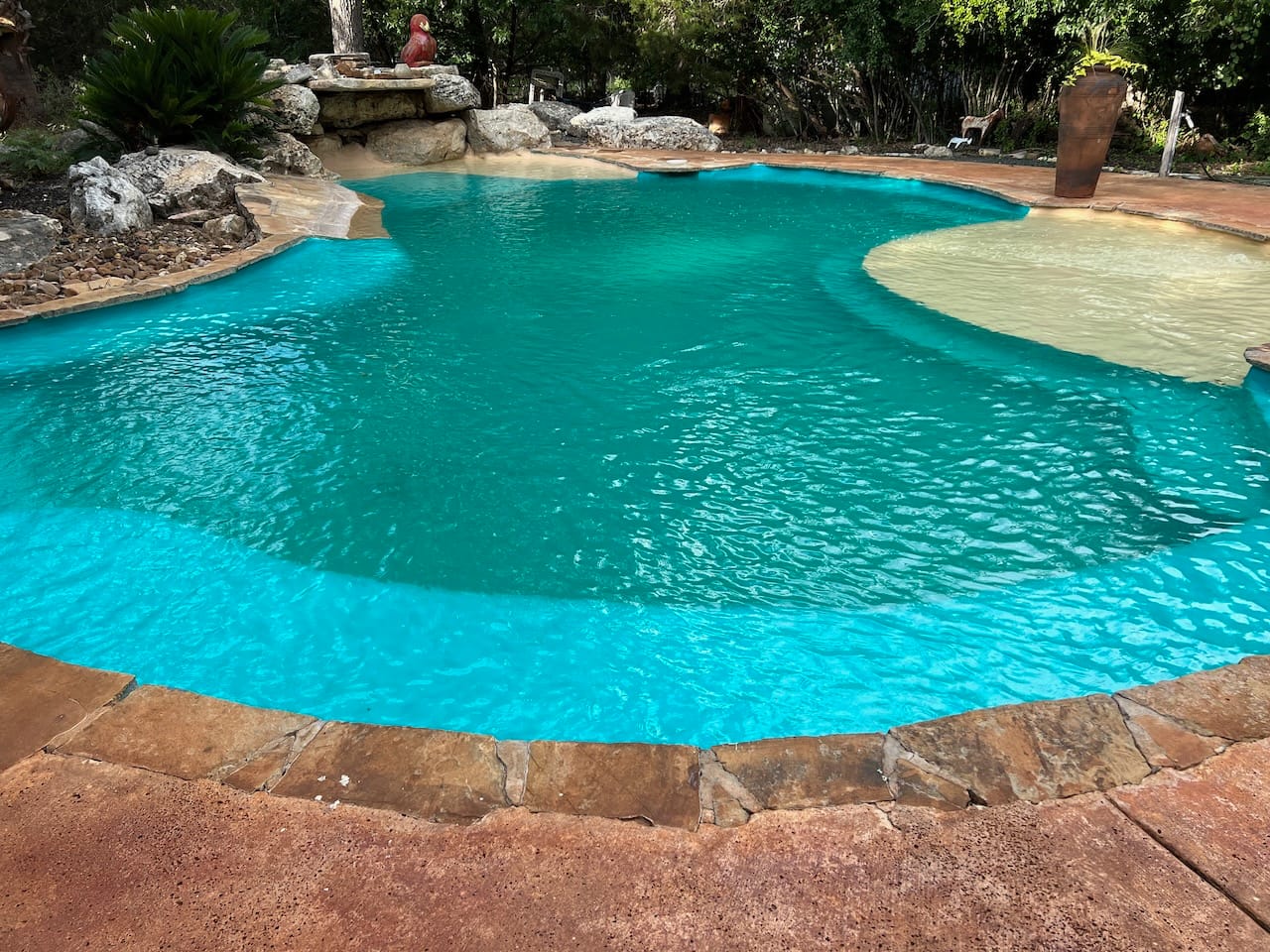 Here is the final result after new paint, fresh water, and replacing our pool sand filter. The water is crystal clear and ready for summer. What a difference!