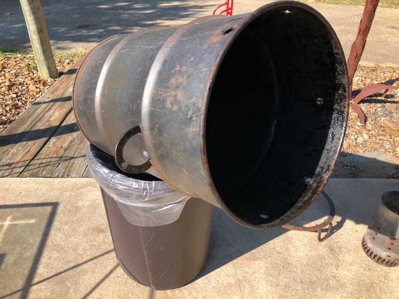 Removing ash from Pit Barrel Cooker through the bottom vent