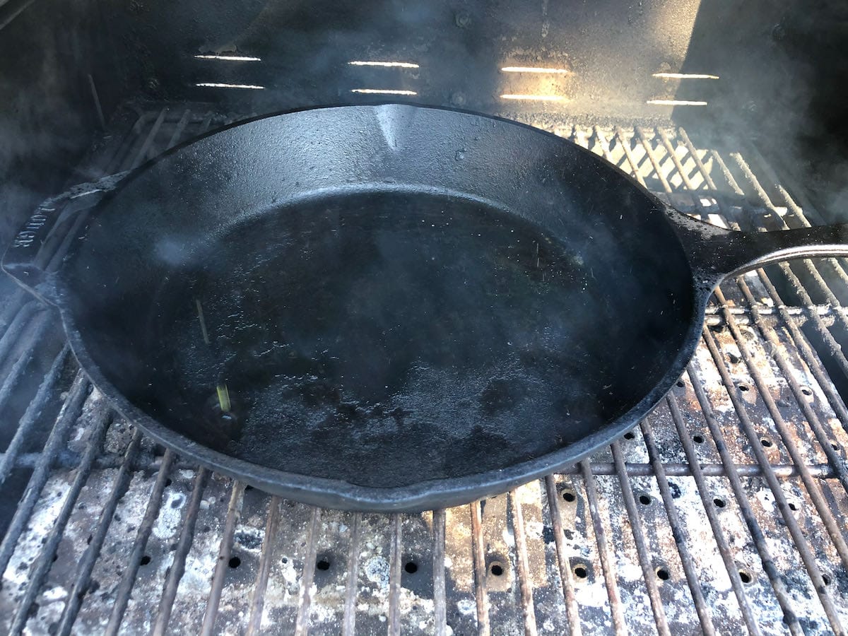 Large side Lodge cast iron skillet on MAK 2 Star pellet grill