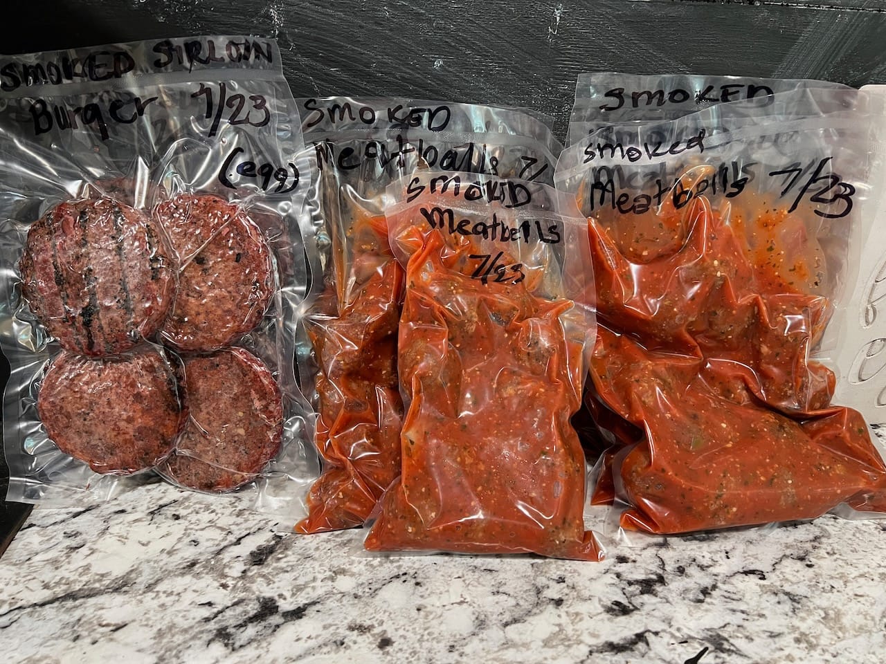 Hamburger patties and meatballs vacuum sealed with the JVR Vac100 chamber vacuum sealer.