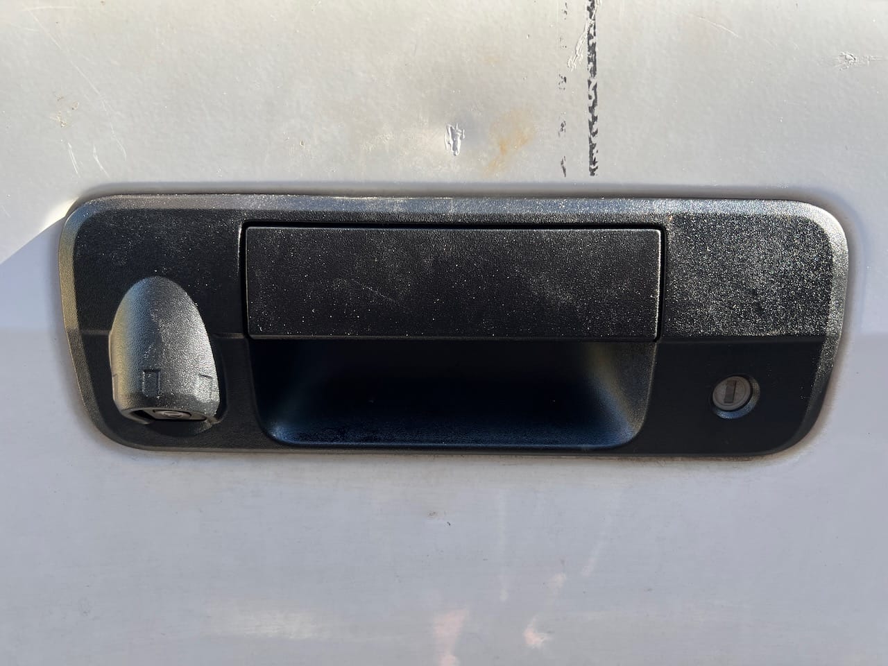New tailgate handle assembly installed on a 2008 Toyota Tundra.