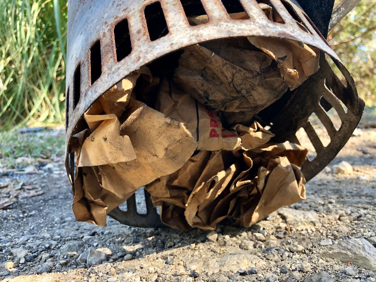 Tear off part of your charcoal bag and place it under your charcoal chimney. This is a great way to start the fire.