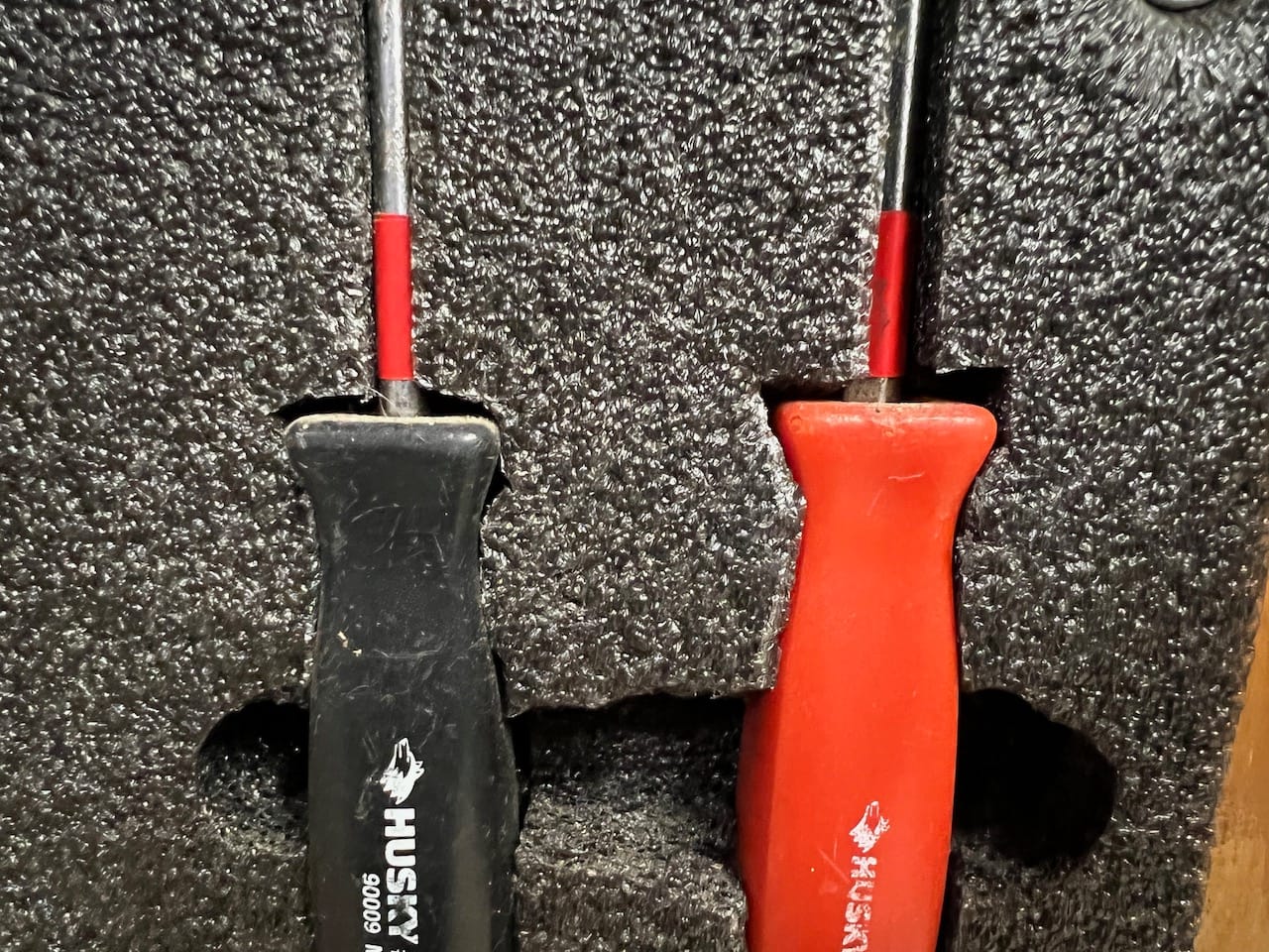 FastCap GPS Tape in red on screwdrivers.
