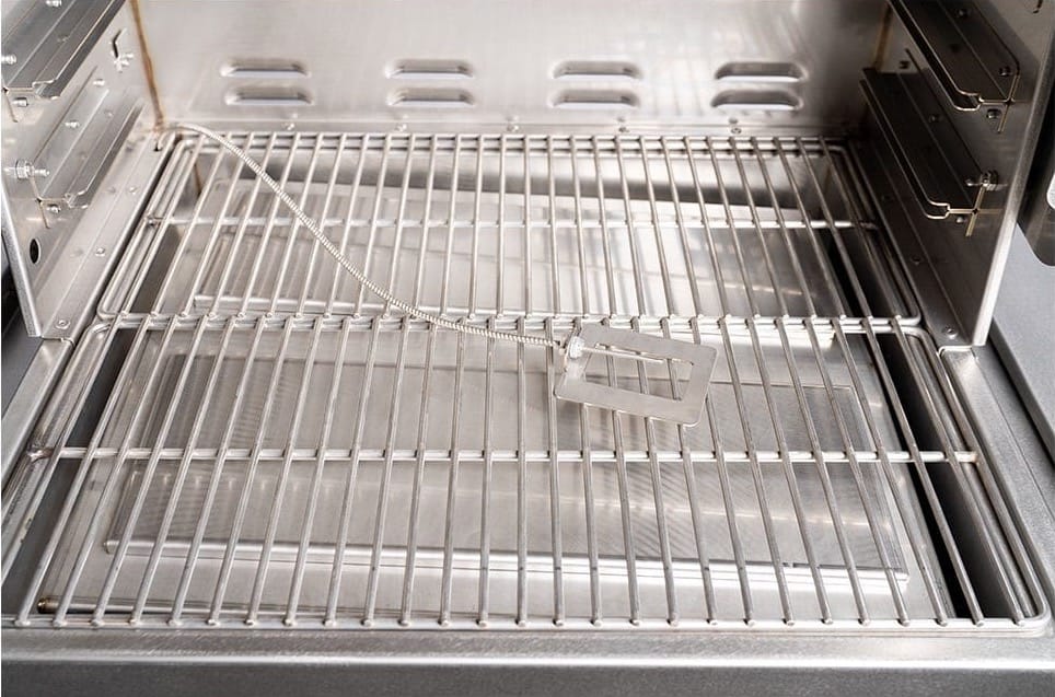 Pictured is a stock photo of the MAK 2 Star stainless steel cooking grate. In this picture, the two FlameZone covers are on. When grilling, you would remove them. Also pictured is the roaming thermocouple which is available on the newer grills.
