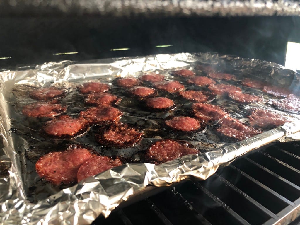 Salami cooking on bottom rack of MAK 2 Star Pellet Grill