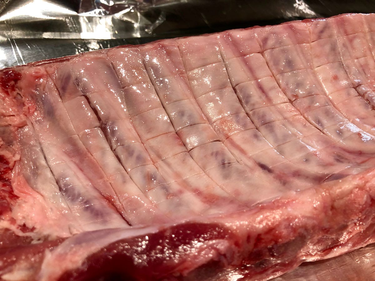 Score membrane on back side of ribs in a cross hatch pattern.