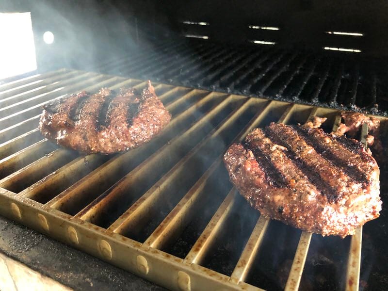 Wagyu burger patties cooking on MAK Searing Grates. If you haven't had Wagyu, your missing out!