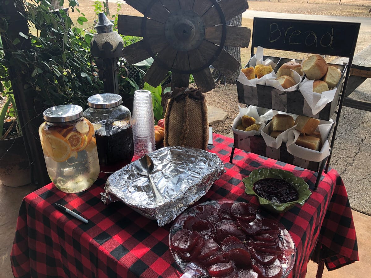 Water, tea, rolls, cranberries, and yams ready for service.