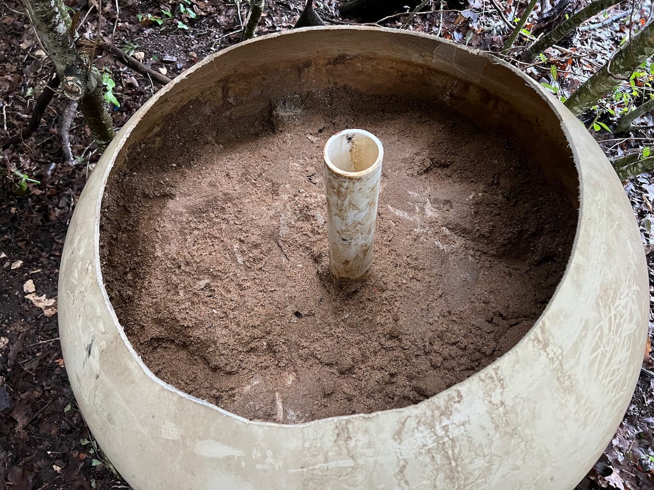 Top cut off of Pentair sand pool filter showing the calcified sand inside.