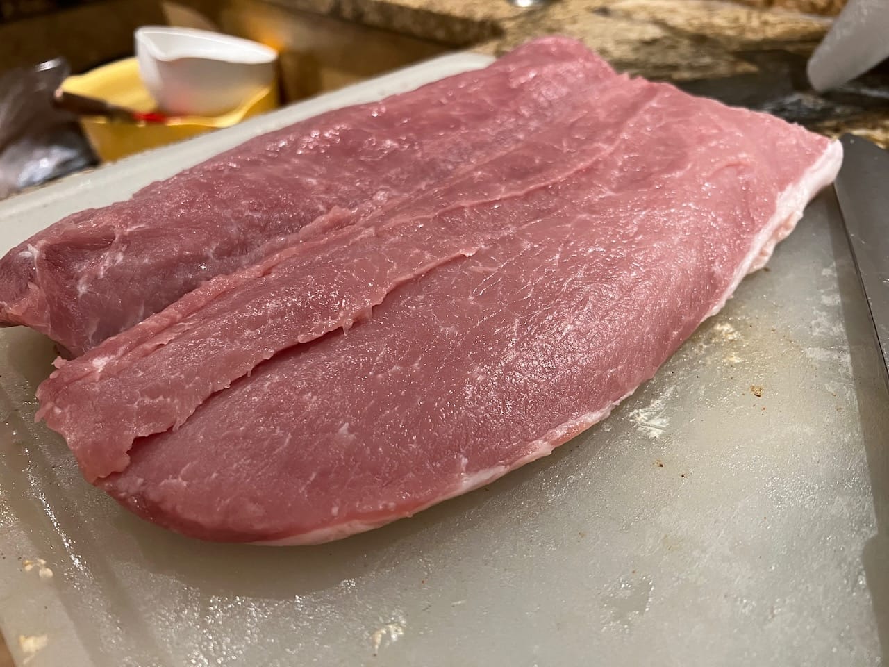 Pork loin butterflied open so we could add ingredients to the inside.