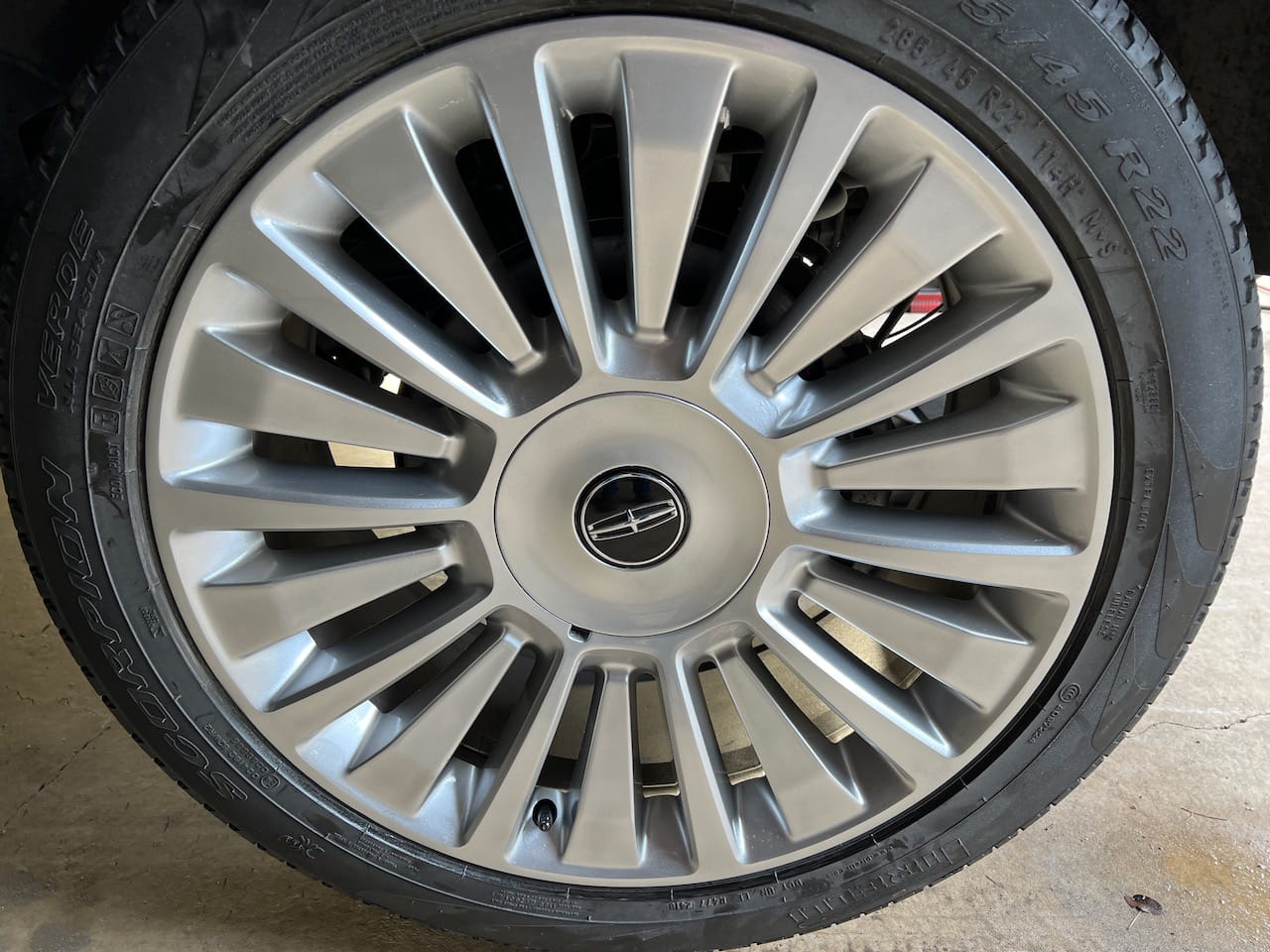 2015 Lincoln Navigator wheel restored and painted one solid color.