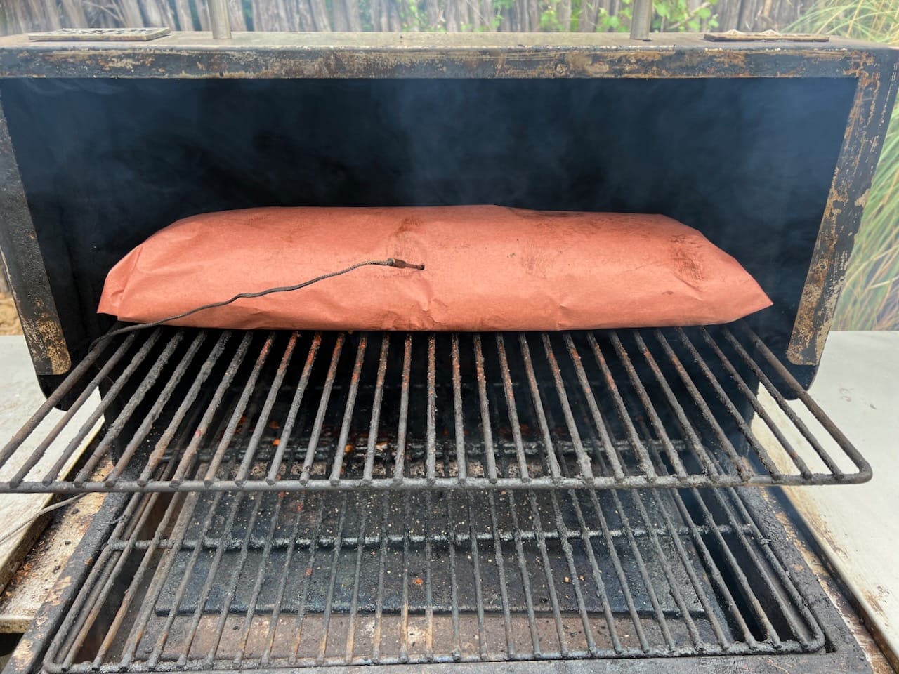 Pork loin on MAK 2 Star pellet grill wrapped in butcher paper.